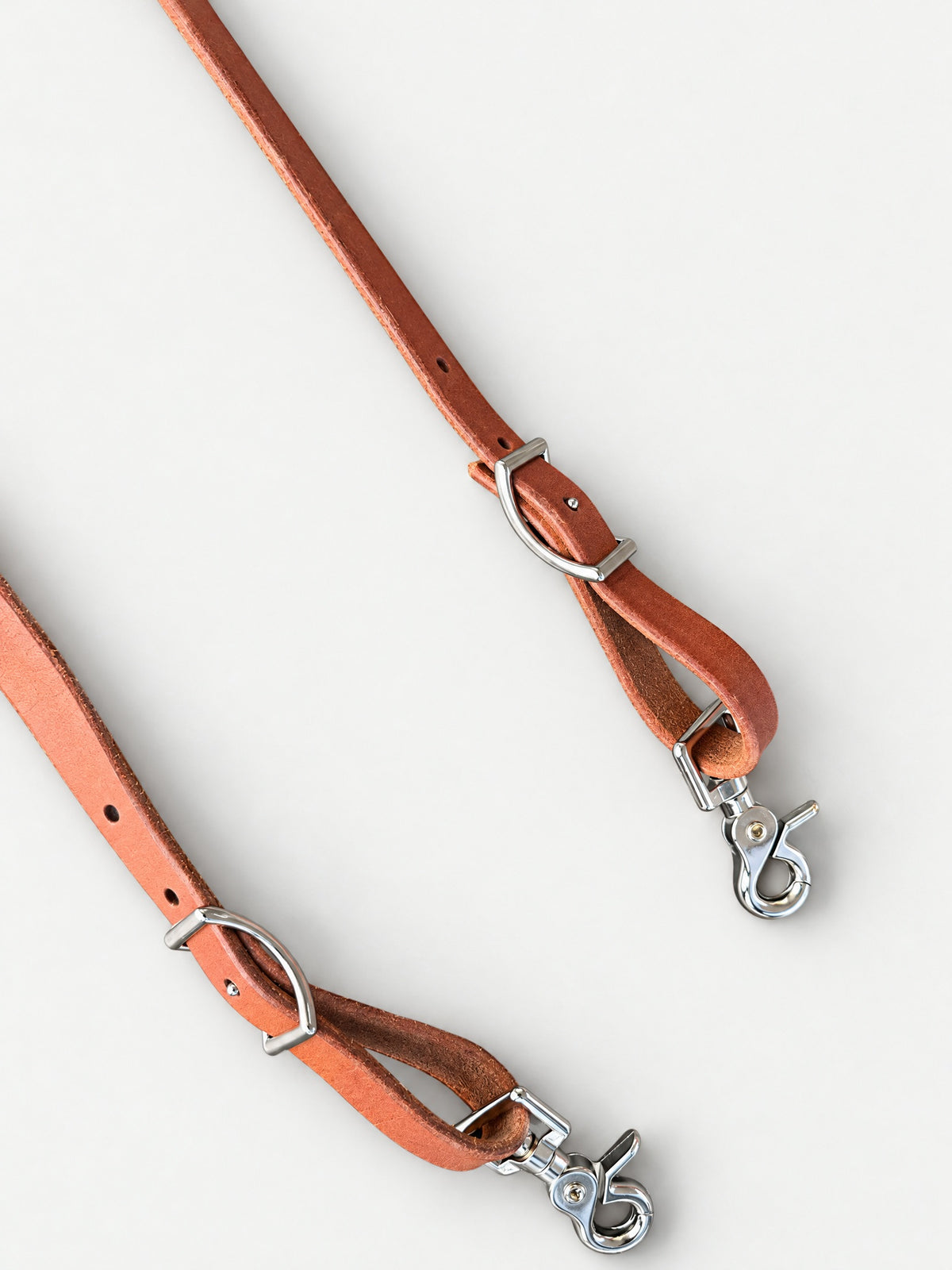 Tan & Hot Pink double-laced leather reins — attachment fittings
