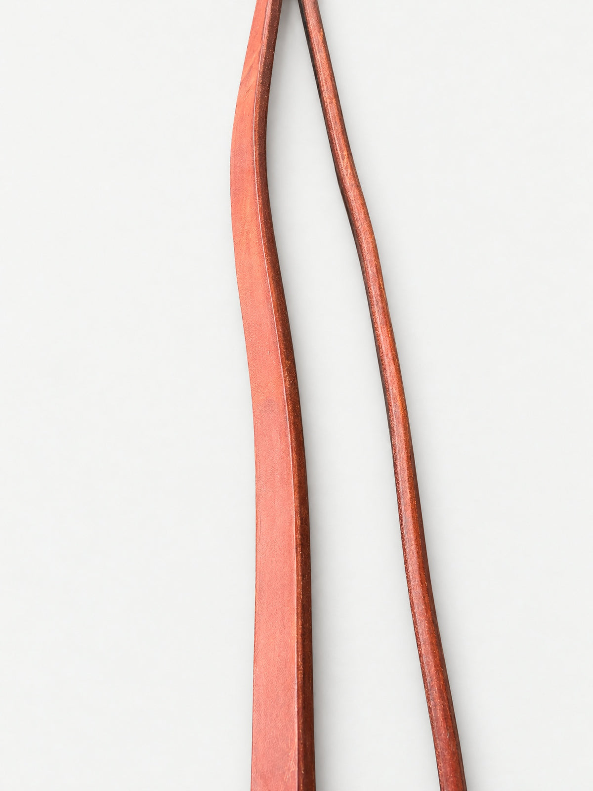 Plain brown leather barrel reins — attachment fittings