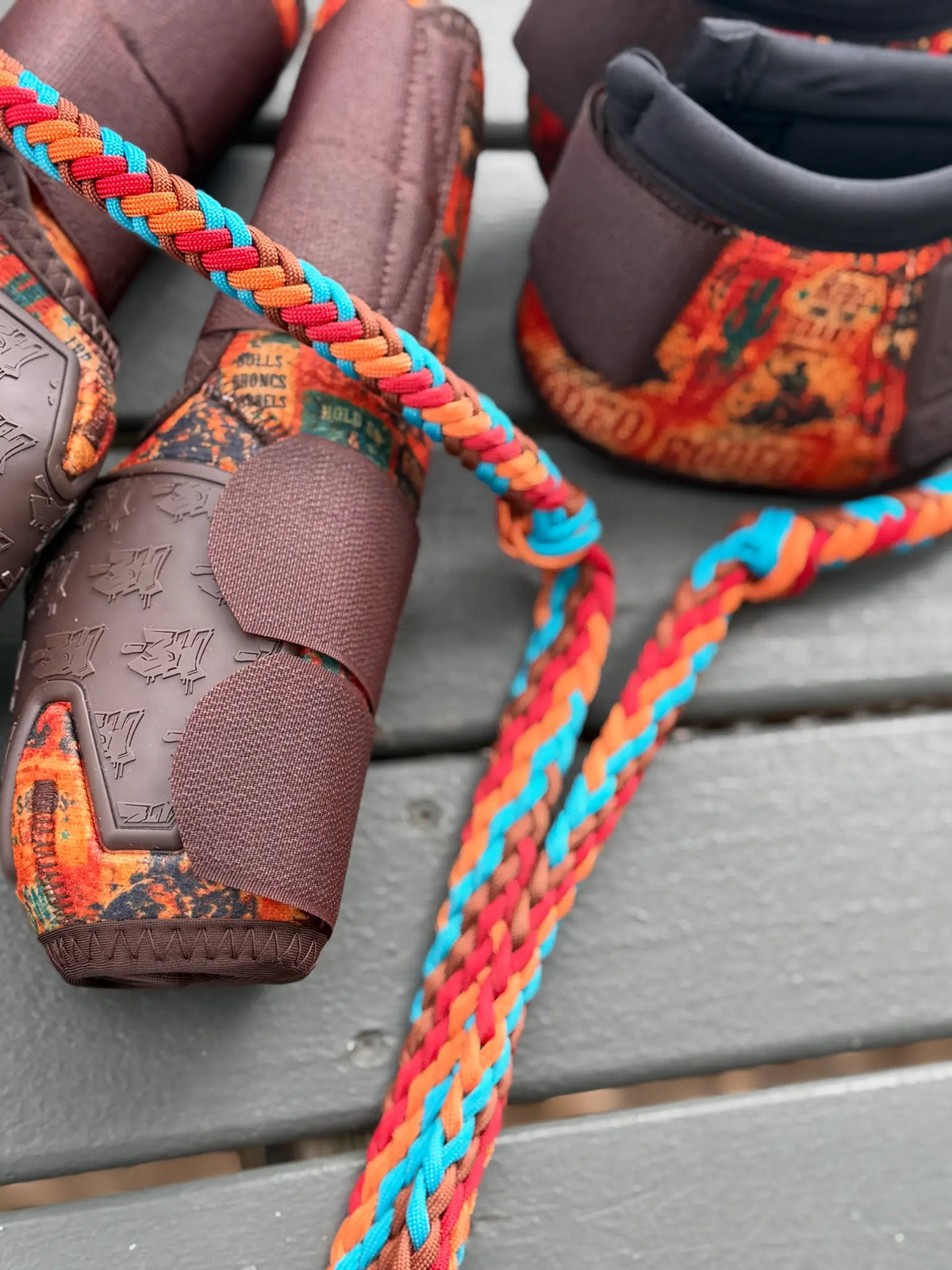 Rust brown, red, orange and turquoise hand-braided stabiliser rein and knot with matching 8 Seconds boots