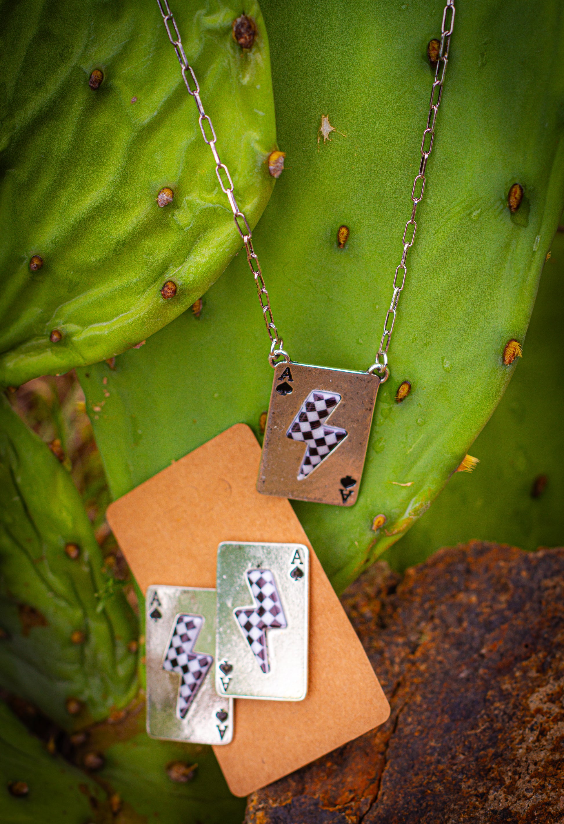 Ace checker lightening bolt earrings with matching necklace