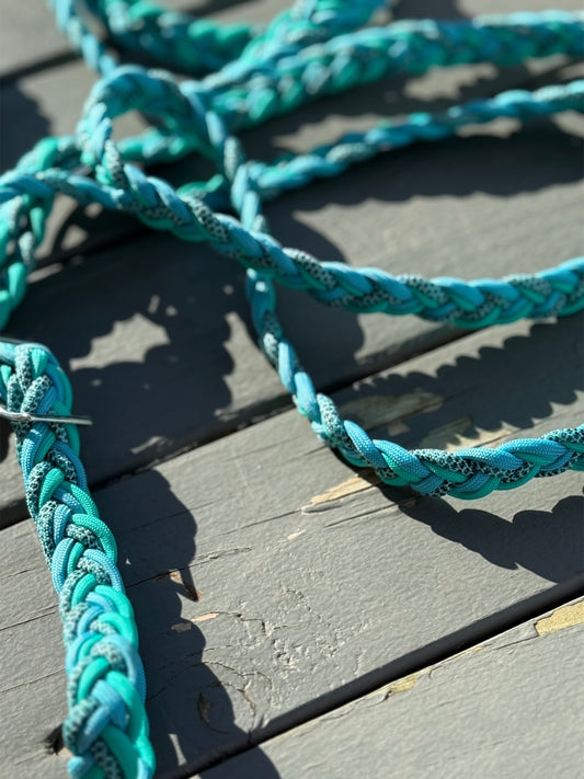 Close-up and full view of turquoise 6-strand flat braid reins with Conway buckles, braided from ocean-toned nylon cord.