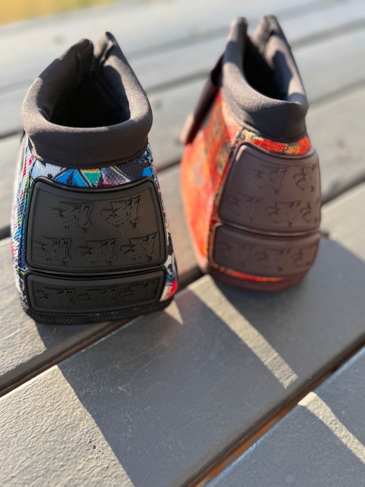 High Stakes and 8 Seconds bell boots showing black and brown bar3H rubber panels and colourful western prints.