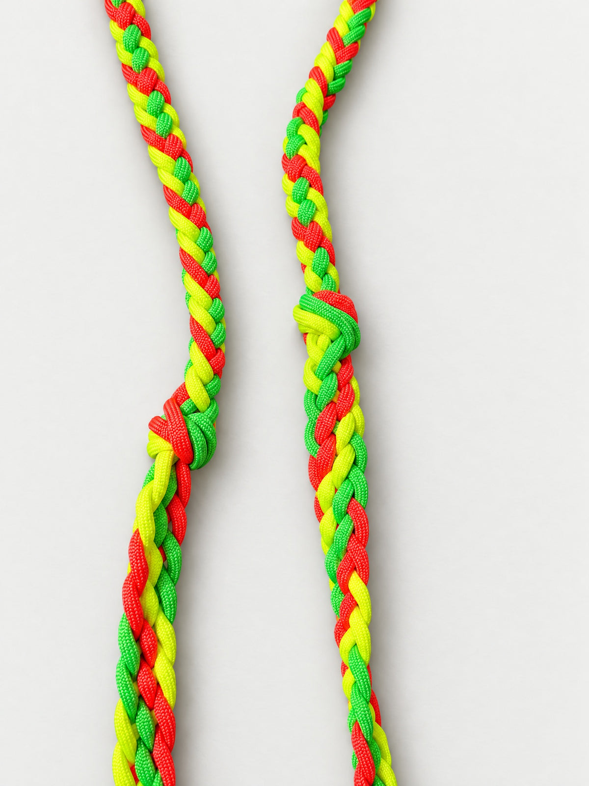Bright green, yellow and red roper reins — three-strand braid detail