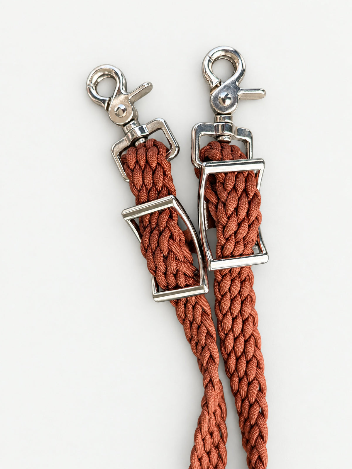 Sunset Orange handbraided barrel reins — attachment fittings