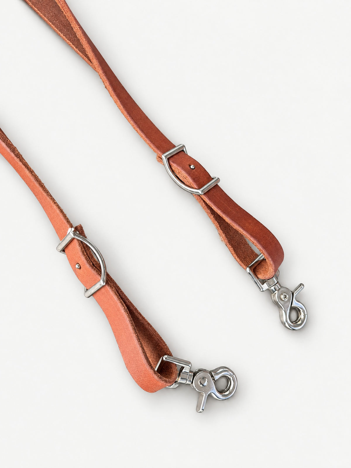 Tan & White laced leather barrel reins — attachment fittings