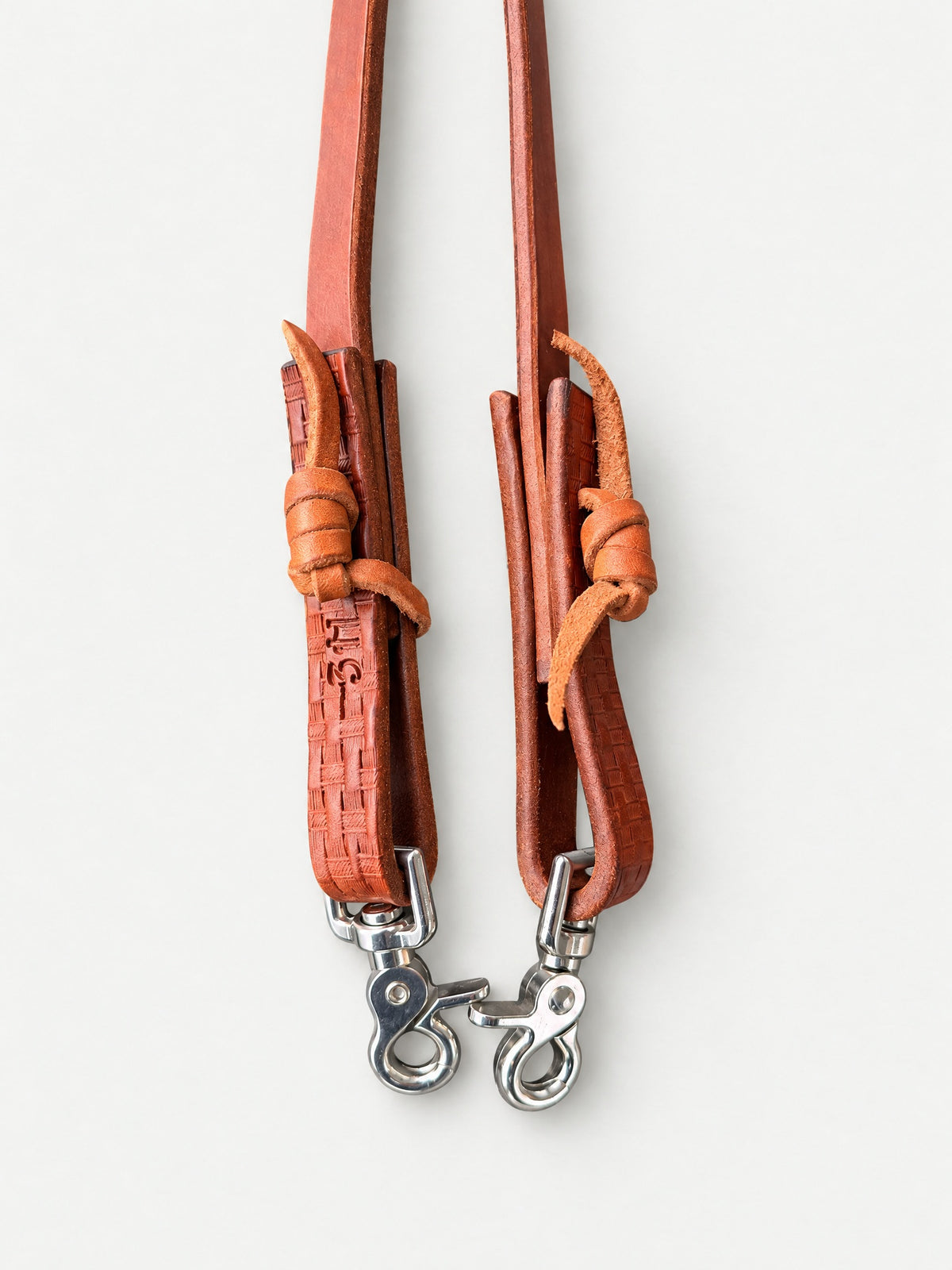 Plain brown leather barrel reins — smooth leather finish detail