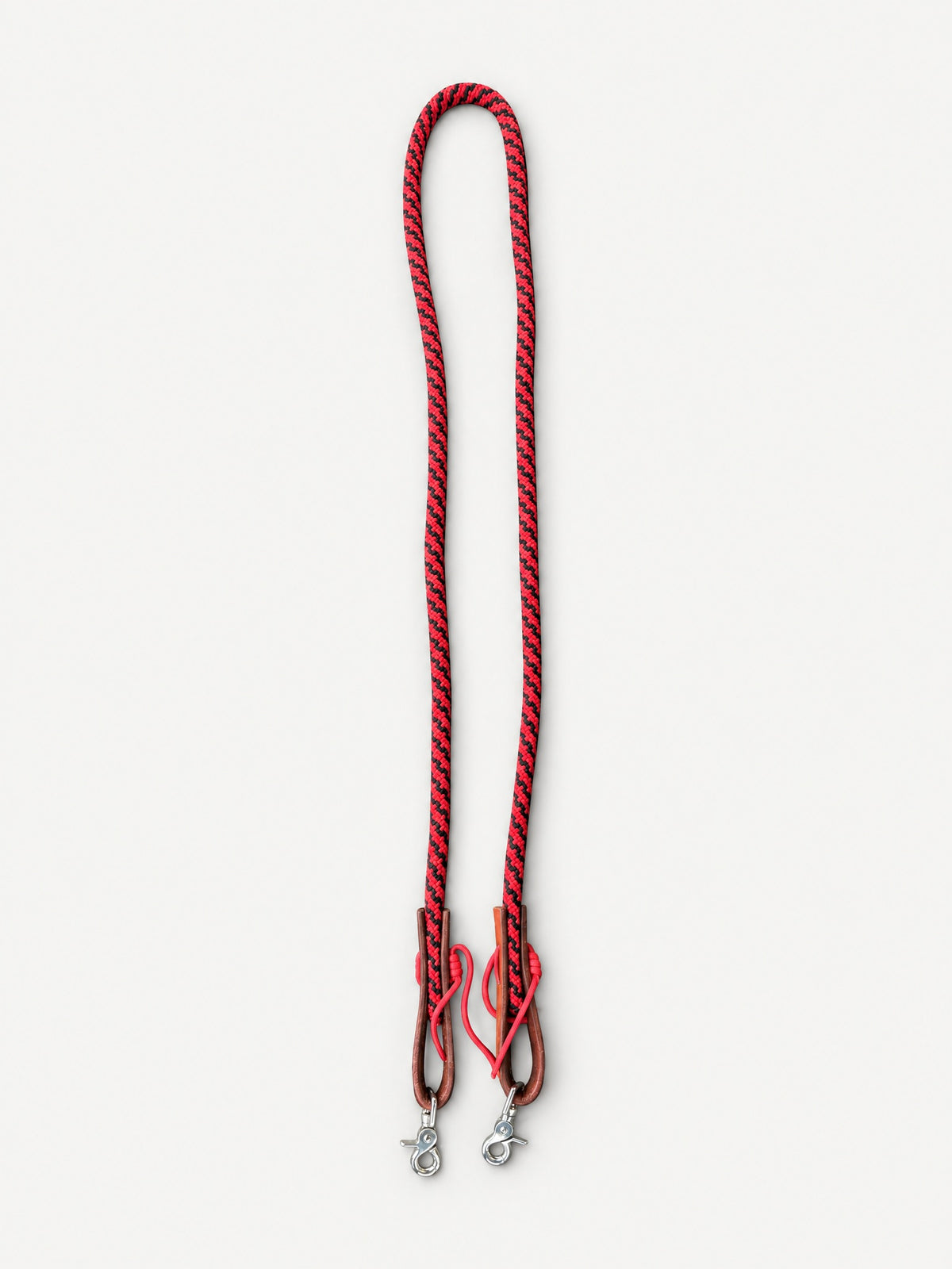Full red and black joined nylon rope reins with brown leather keepers and trigger snaps
