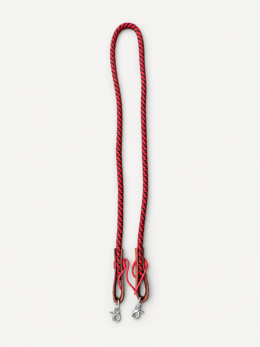 Full red and black joined nylon rope reins with brown leather keepers and trigger snaps