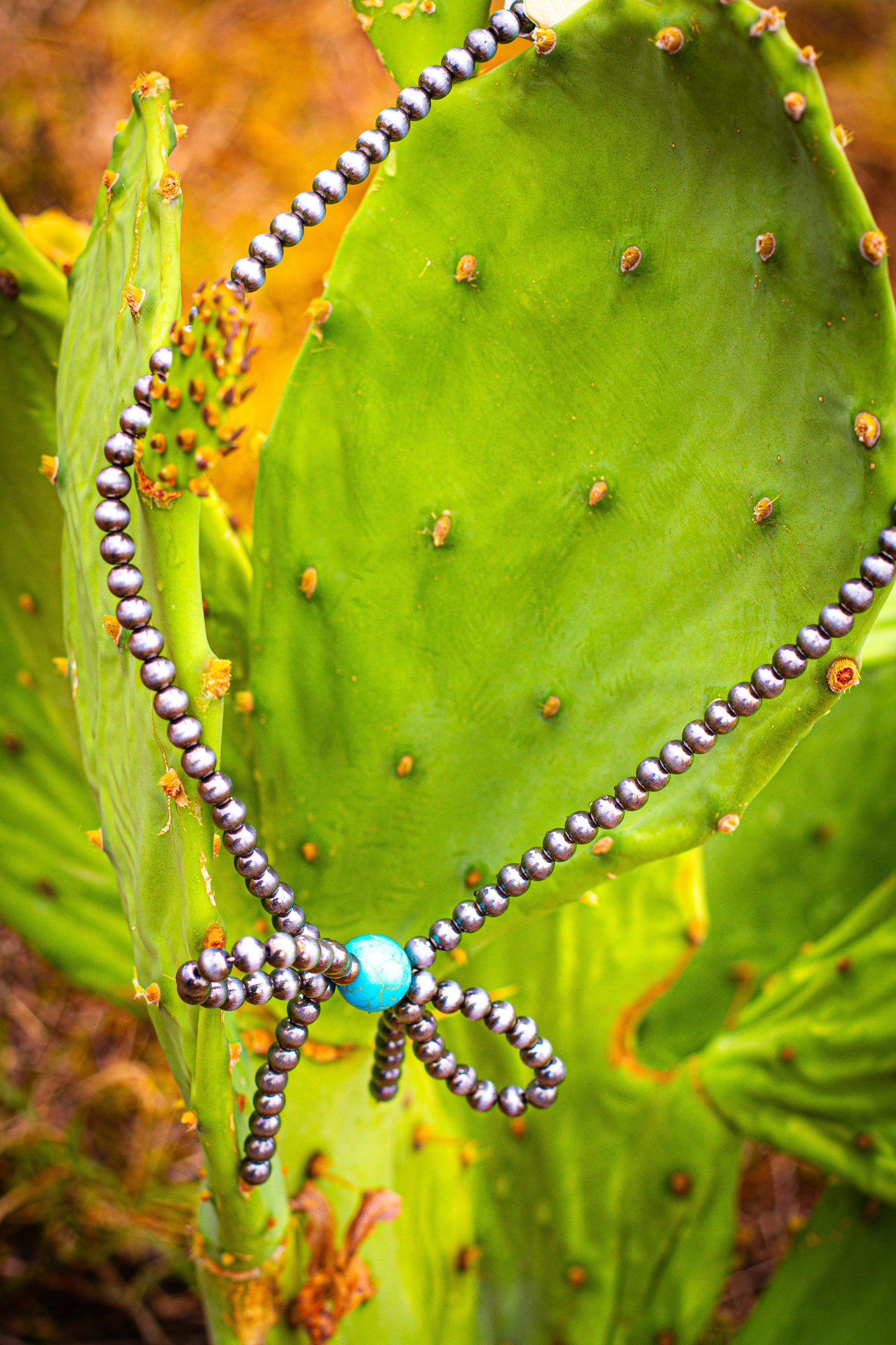 Silver pearl and turquoise bow necklace